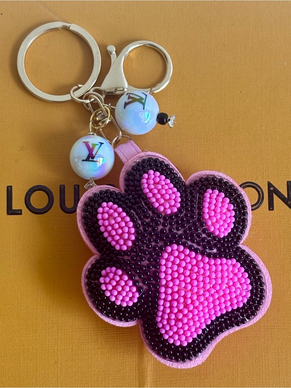 Louis Vuitton Pink Puffy Print Bag Charm with beads. 5 inches